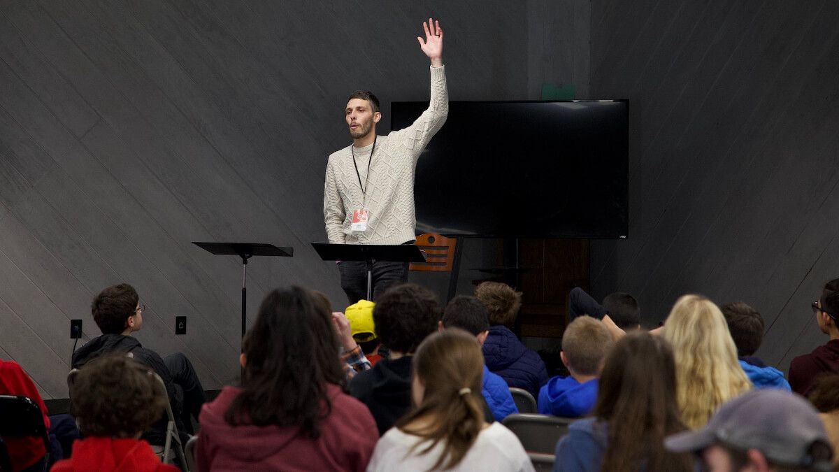 pastor preaching to students