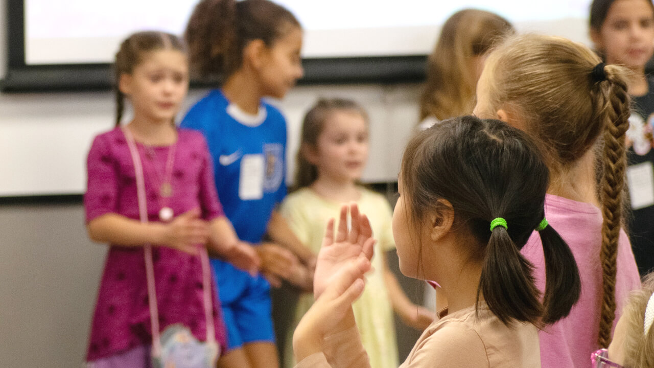 kids raising hands