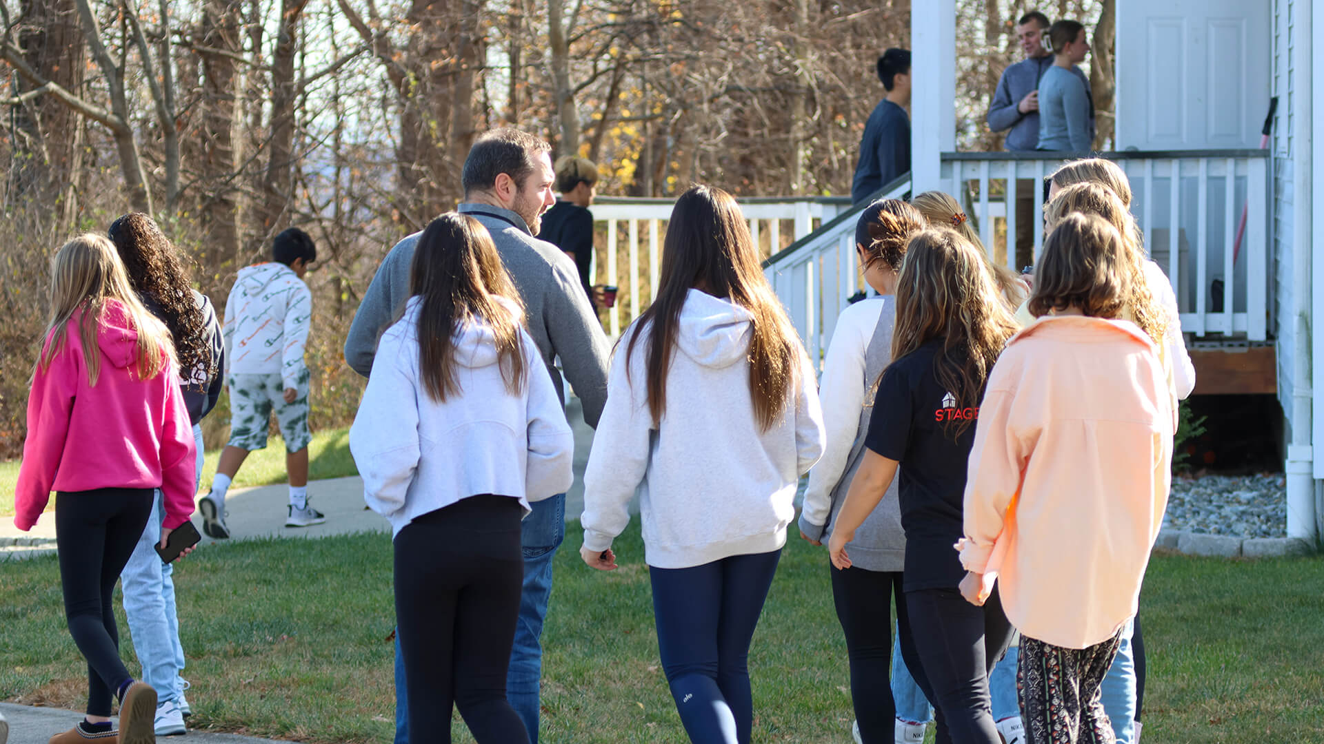 students walking with backs to camera