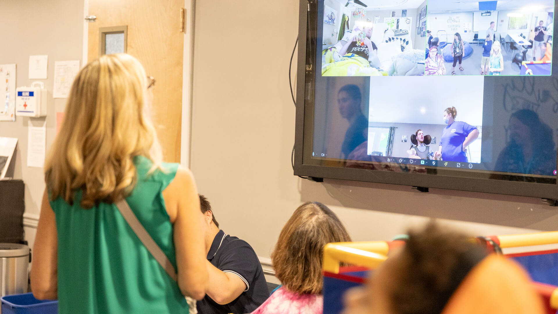 woman looking at screen with zoom meeting