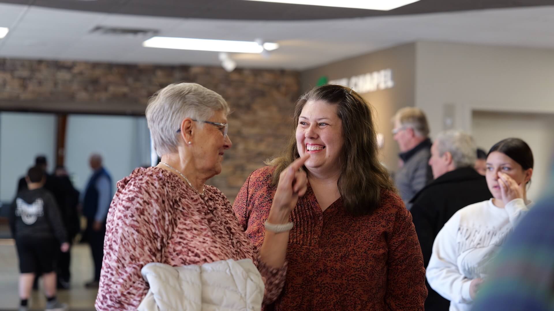 older woman smiling at younger