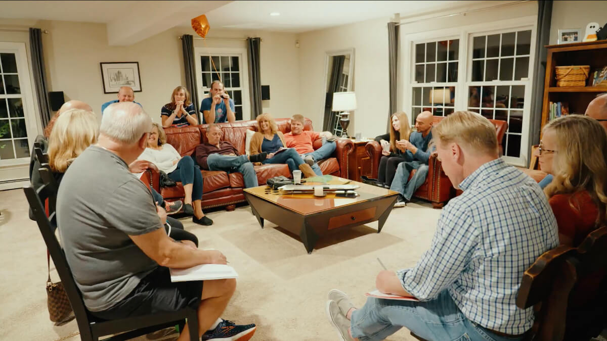 group of people sitting in a living room
