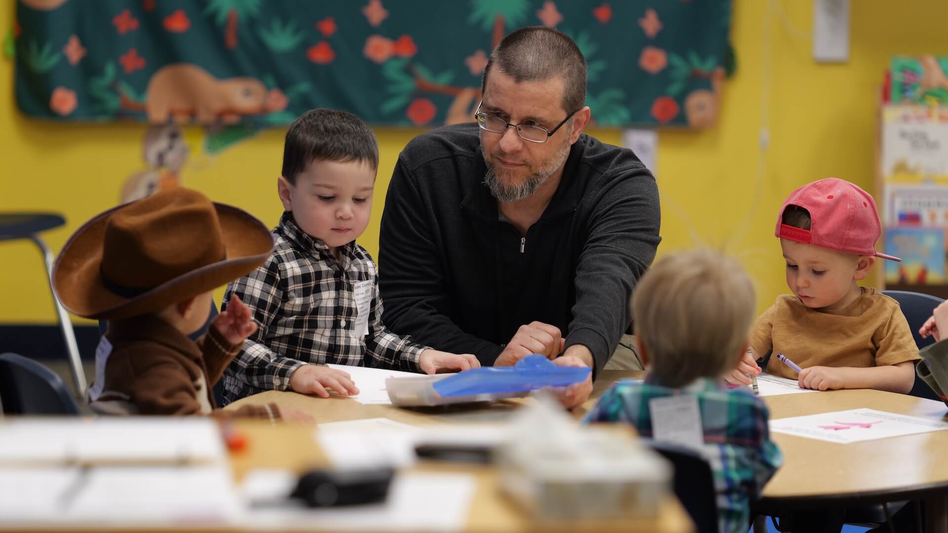 man playing with kids